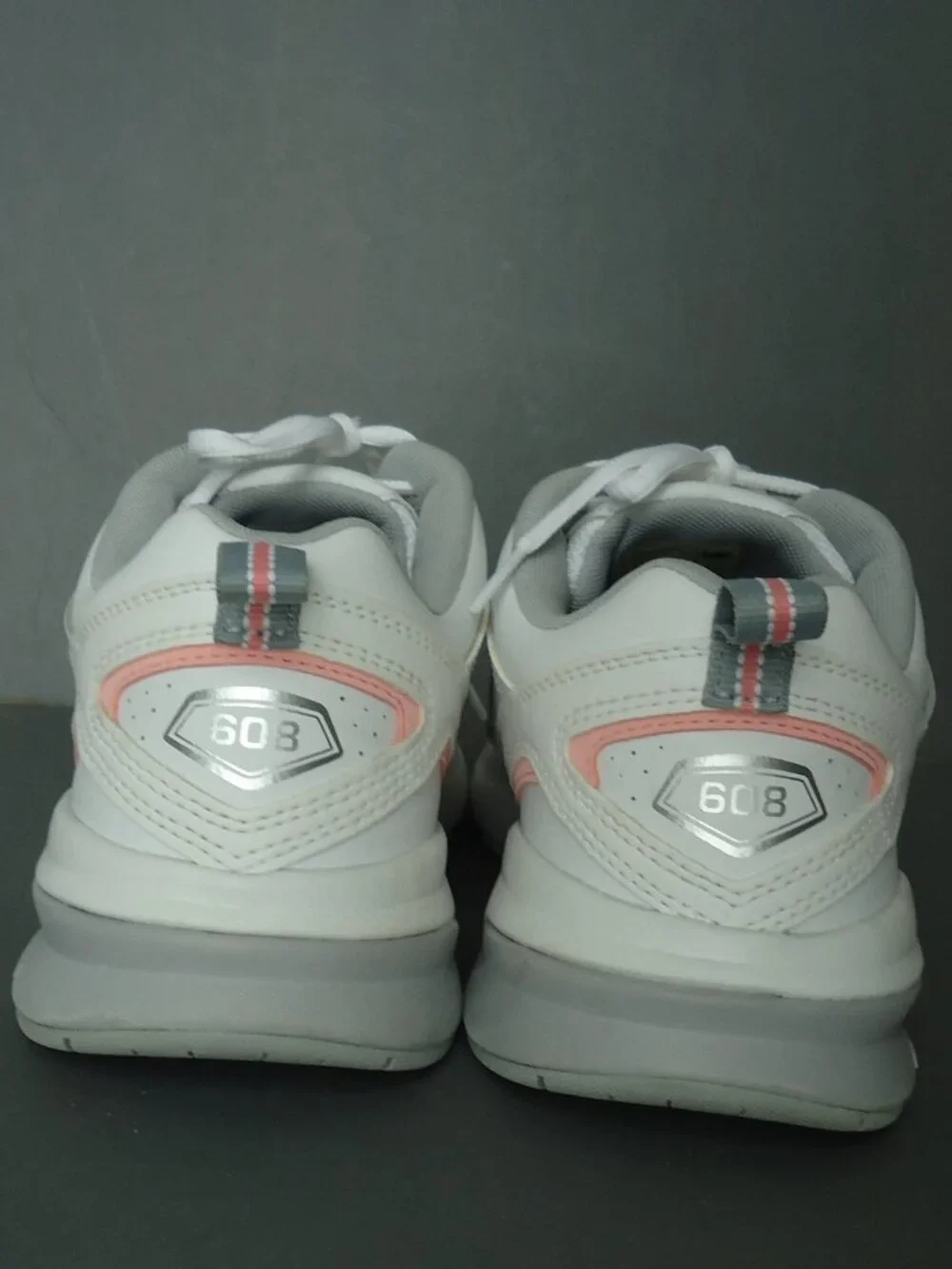 SIZE 9.5. D. New Balance women's white leather sneakers shoes.